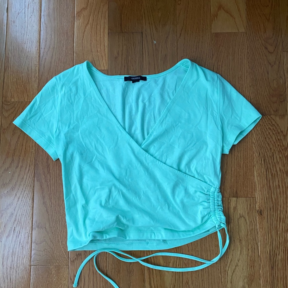 Green crop top shirt with ties on the side